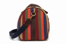 Side view close-up showing East African stripe pattern, leather trim and stitching detail