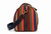 Side view close-up showing East African stripe pattern, leather trim and stitching detail